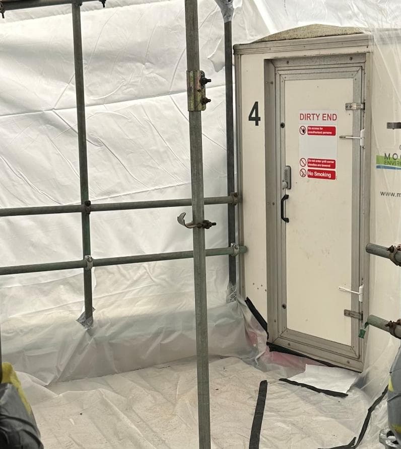 Decontamination unit door marked Dirty End inside the enclosure