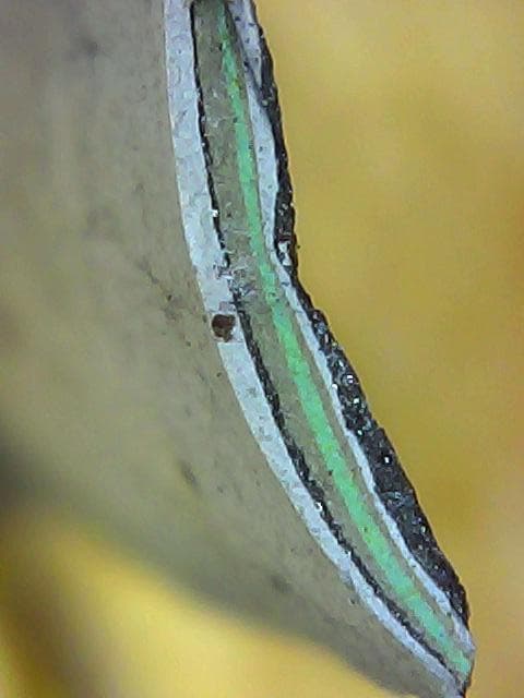 Microscope cross-section of the existing paint layers