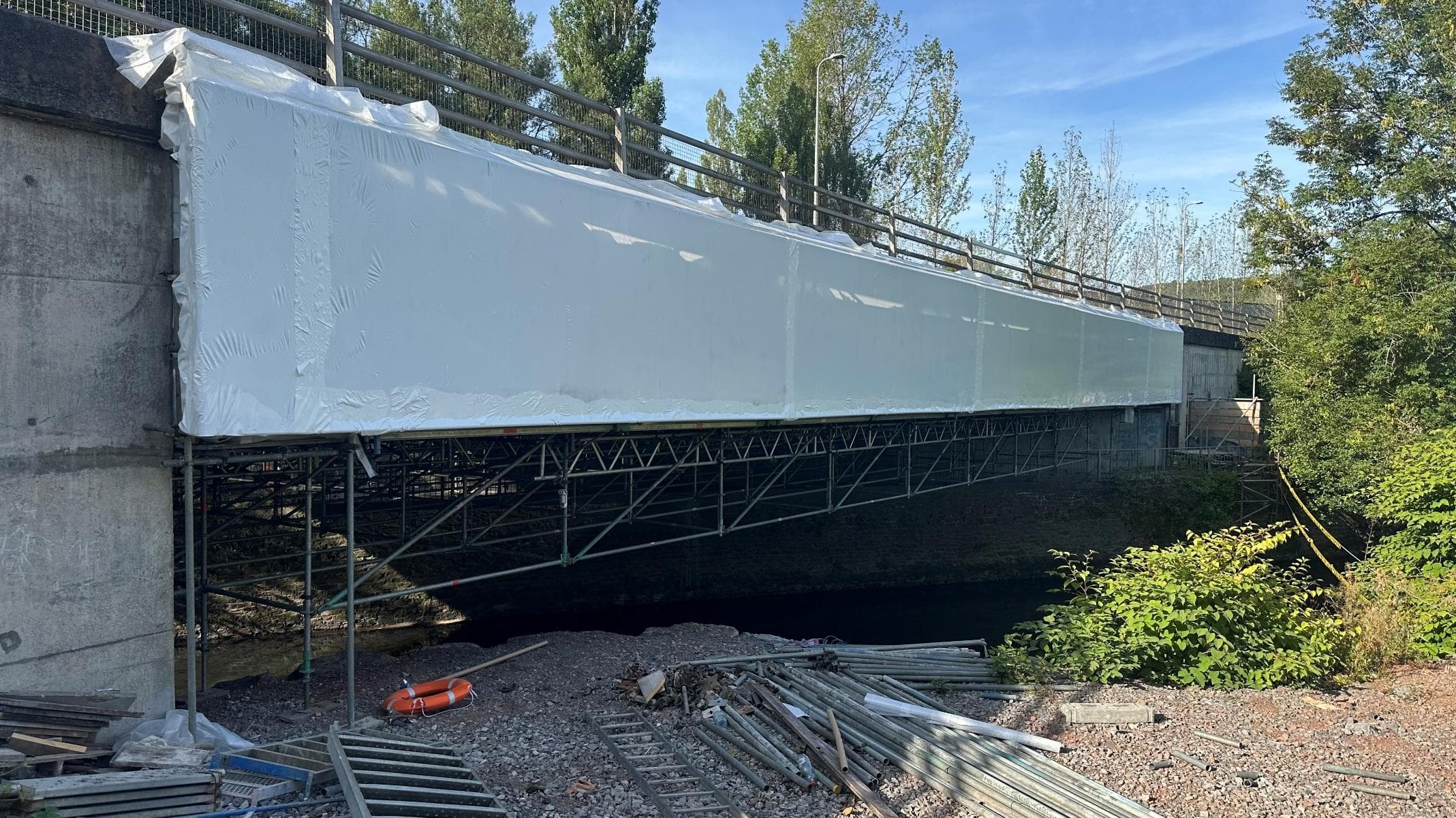 Afon Cynon Bridge wrapped in a sealed white enclosure for Cr(VI) paint removal