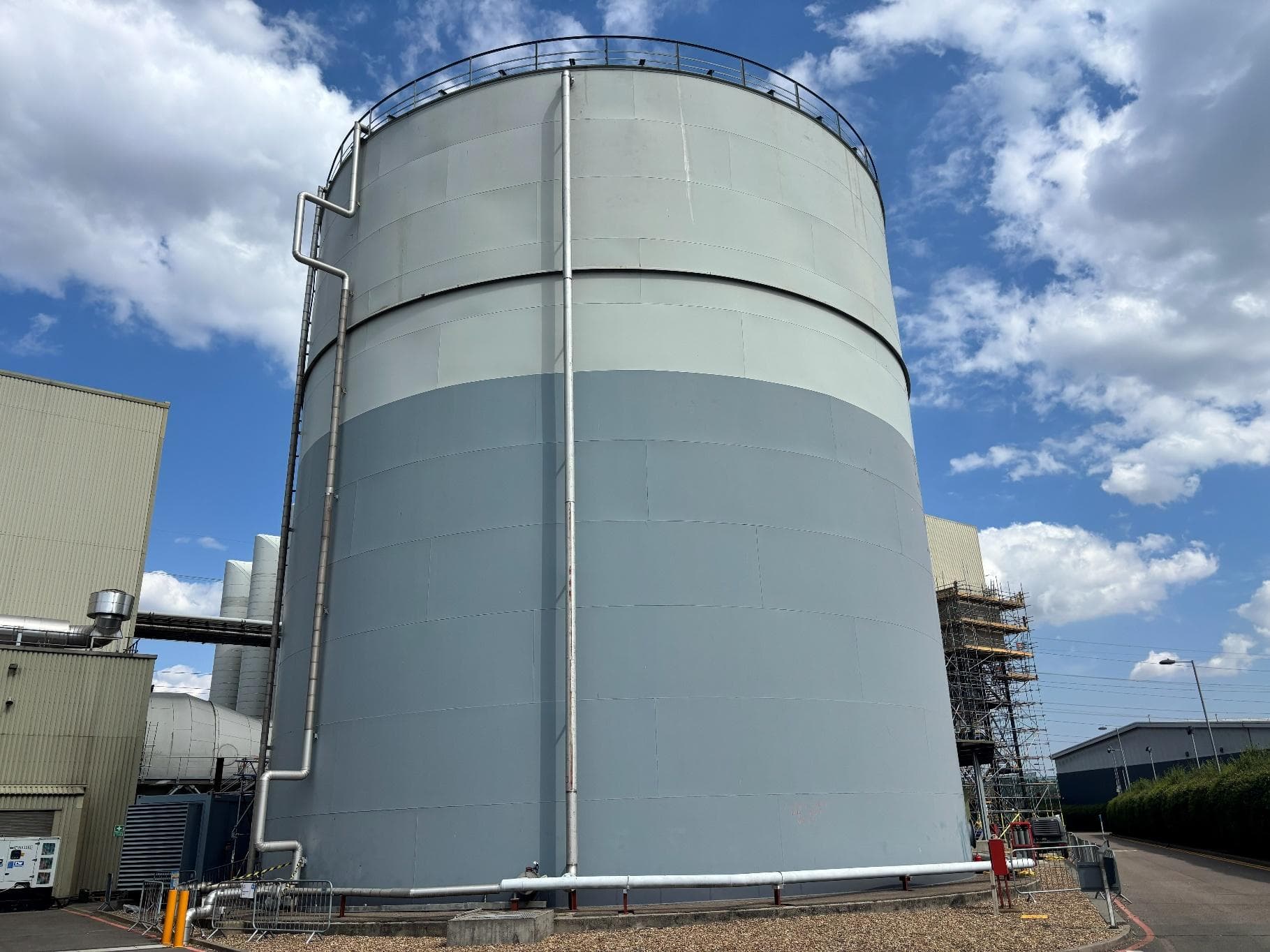 Large raw water storage tank at the Uniper site with scaffold access